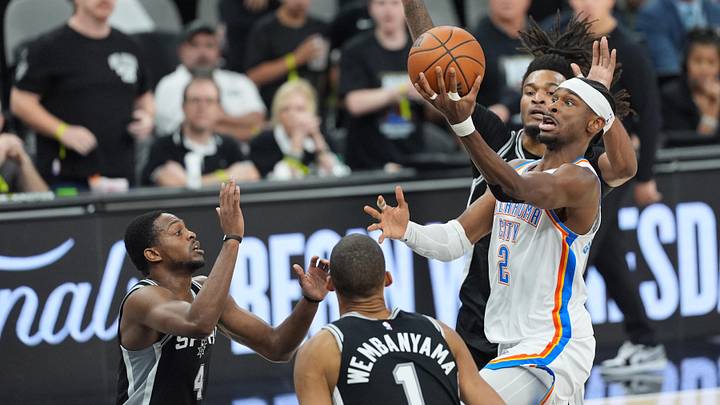 Shai Gilgeous-Alexander surrounded by defenders in the Western Conference finals.