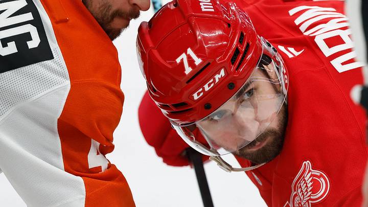 Mar 28, 2026; Detroit, Michigan, USA;  Philadelphia Flyers center Luke Glendening (41) and Detroit Red Wings center Dylan Larkin (71) gets set to face off in the second period at Little Caesars Arena. Mandatory Credit: Rick Osentoski-Imagn Images