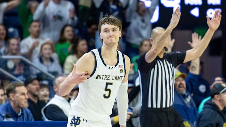 Feb 28, 2026; South Bend, Indiana, USA; Notre Dame Fighting Irish guard Cole Certa (5) celebrates making a 3-point shot during overtime at Purcell Pavilion at the Joyce Center. 