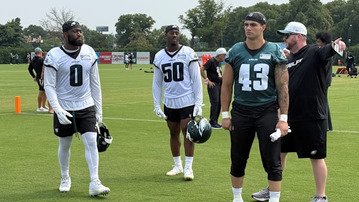 Eagles, from left to right, Josh Uche, Ogbo Okoronkwo, and Ben VanSumeren leave the field after Day 10 of training camp. Eagles, from left to right, Josh Uche, Ogbo Okoronkwo, and Ben VanSumeren leave the field after Day 10 of training camp.