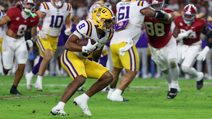Nov 8, 2025; Tuscaloosa, Alabama, USA; Louisiana State Tigers running back Ju'Juan Johnson (8) carries the ball against the Alabama Crimson Tide during the first quarter of the game at Saban Field at Bryant-Denny Stadium. Mandatory Credit: David Leong-Imagn Images