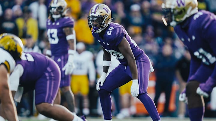 Khmori House started five games as a freshman linebacker for the Huskies. 