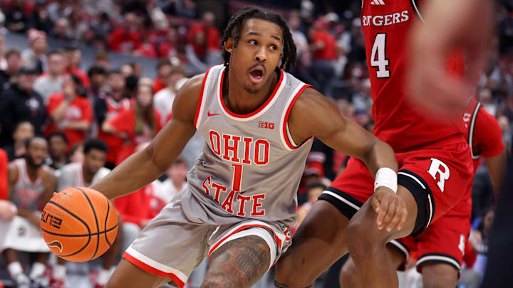 Dec 7, 2024; Columbus, Ohio, USA;  Ohio State Buckeyes guard Meechie Johnson Jr. (1) controls the ball as Rutgers Scarlet Knights guard Ace Bailey (4) defends during the second half at Value City Arena. Mandatory Credit: Joseph Maiorana-Imagn Images