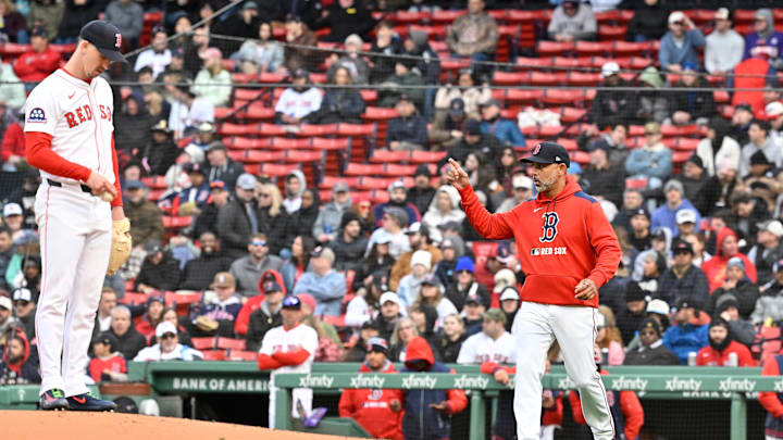 Apr 10, 2025; Boston, Massachusetts, USA; Boston Red Sox manager Alex Cora (13) signals to the bullpen as he heads out to relive starting pitcher Walker Buehler (0) of pitching duties during the seventh inning against the Toronto Blue Jays at Fenway Park. Mandatory Credit: Eric Canha-Imagn Images Apr 10, 2025; Boston, Massachusetts, USA; Boston Red Sox manager Alex Cora (13) signals to the bullpen as he heads out to relive starting pitcher Walker Buehler (0) of pitching duties during the seventh inning against the Toronto Blue Jays at Fenway Park. Mandatory Credit: Eric Canha-Imagn Images