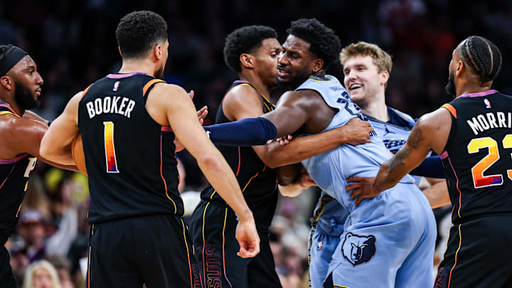 Dec 31, 2024; Phoenix, Arizona, USA; Phoenix Suns guard Devin Booker (1) and forward Ryan Dunn and Memphis Grizzlies guard Cam Spencer (24) and forward-center Jaren Jackson Jr. (13) react during the fourth quarter of the game at Footprint Center. Mandatory Credit: Aryanna Frank-Imagn Images Dec 31, 2024; Phoenix, Arizona, USA; Phoenix Suns guard Devin Booker (1) and forward Ryan Dunn and Memphis Grizzlies guard Cam Spencer (24) and forward-center Jaren Jackson Jr. (13) react during the fourth quarter of the game at Footprint Center. Mandatory Credit: Aryanna Frank-Imagn Images