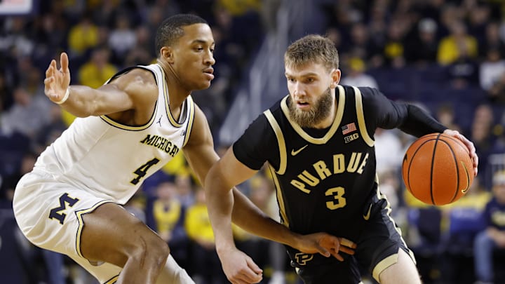 Purdue guard Braden Smith (3) dribbles defended by Michigan guard Nimari Burnett (4) Purdue guard Braden Smith (3) dribbles defended by Michigan guard Nimari Burnett (4)