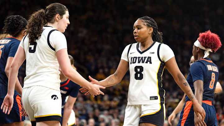 Iowa center Ava Heiden (5) high-fives Iowa guard Journey Houston (8) during a game against the Illinois Fighting Illini Feb. 26, 2026 at Carver-Hawkeye Arena in Iowa City, Iowa. Iowa center Ava Heiden (5) high-fives Iowa guard Journey Houston (8) during a game against the Illinois Fighting Illini Feb. 26, 2026 at Carver-Hawkeye Arena in Iowa City, Iowa.