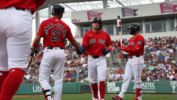Feb 22, 2026; Fort Myers, Florida, USA; Boston Red Sox infielder Caleb Durbin (17) is congratulated by infielder Isiah Kiner-Falefa (2) after he scored during the first inning against the Toronto Blue Jays at JetBlue Park at Fenway South. Mandatory Credit: Kim Klement Neitzel-Imagn Images Feb 22, 2026; Fort Myers, Florida, USA; Boston Red Sox infielder Caleb Durbin (17) is congratulated by infielder Isiah Kiner-Falefa (2) after he scored during the first inning against the Toronto Blue Jays at JetBlue Park at Fenway South. Mandatory Credit: Kim Klement Neitzel-Imagn Images