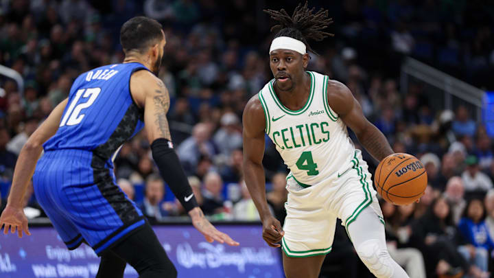 Dec 23, 2024; Orlando, Florida, USA; Boston Celtics guard Jrue Holiday (4) is guarded by Orlando Magic guard Trevelin Queen (12) in the first quarter at Kia Center. Mandatory Credit: Nathan Ray Seebeck-Imagn Images Dec 23, 2024; Orlando, Florida, USA; Boston Celtics guard Jrue Holiday (4) is guarded by Orlando Magic guard Trevelin Queen (12) in the first quarter at Kia Center. Mandatory Credit: Nathan Ray Seebeck-Imagn Images