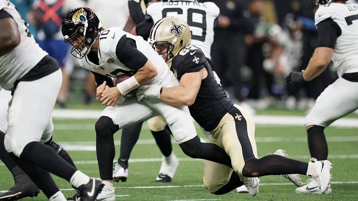 Aug 15, 2026; New Orleans, Louisiana, USA; New Orleans Saints defensive lineman Michael Heldman (63) sacks Jacksonville Jaguars quarterback Carter Bradley (10) during the second quarter at Caesars Superdome. Mandatory Credit: Matthew Hinton-Imagn Images