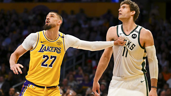 Former Los Angeles Lakers center Alex Len (27) defends against Milwaukee Bucks center Brook Lopez (11) during the first half at Crypto.com Arena. Man