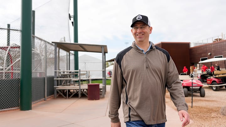 Reds president of baseball operations Nick Krall walks between fields at the Cincinnati Reds Player Development Complex in Goodyear, Ariz., on Wednesday, Feb. 12, 2025.