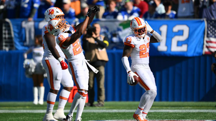 Oct 5, 2025; Seattle, Washington, USA; Tampa Bay Buccaneers safety Tykee Smith (23) and teammates celebrate a fumble recovery against the Seattle Seahawks during the first half at Lumen Field. Mandatory Credit: Steven Bisig-Imagn Images Oct 5, 2025; Seattle, Washington, USA; Tampa Bay Buccaneers safety Tykee Smith (23) and teammates celebrate a fumble recovery against the Seattle Seahawks during the first half at Lumen Field. Mandatory Credit: Steven Bisig-Imagn Images
