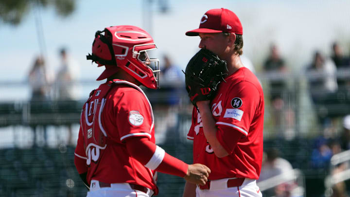 Feb 24, 2025; Goodyear, Arizona, USA; Cincinnati Reds catcher Jose Trevino (35) Hunter Feduccia (67) talks with Cincinnati Reds pitcher Brady Singer (51) during the second inning of the game against the Los Angeles Dodgers at Goodyear Ballpark. Mandatory Credit: Joe Camporeale-Imagn Images