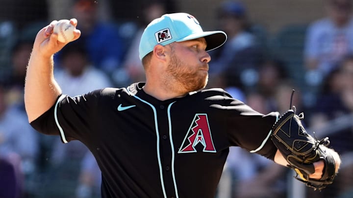 Arizona Diamondbacks pitcher Corbin Burnes throws to the Colorado Rockies in his debut on opening day of the spring training season at Salt River Fields at Talking Stick in Scottsdale on Feb. 21, 2025.