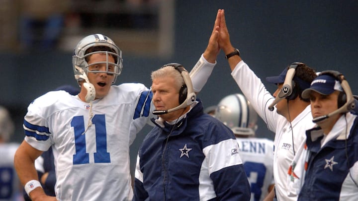 Dallas Cowboys quarterback Drew Bledsoe is congratulated by a coach as head coach Bill Parcells watches the point after attempt against the Seattle Seahawks.