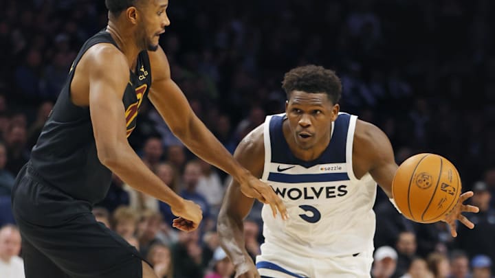 Jan 8, 2026; Minneapolis, Minnesota, USA; Cleveland Cavaliers forward Evan Mobley (4) defends against Minnesota Timberwolves guard Anthony Edwards (5) in the fourth quarter at Target Center. Mandatory Credit: Bruce Kluckhohn-Imagn Images