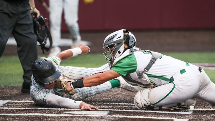 Falfurrias’ Ben Benavides tags Bishop runner Matt Reyna out at home during Game 1 of the Class 3A Division I area baseball playoff series on May 8, 2025, in Corpus Christi, Texas.