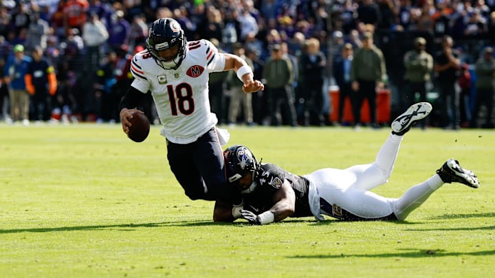 Oct 26, 2025; Baltimore, Maryland, USA; Chicago Bears quarterback Caleb Williams (18) is sacked by Baltimore Ravens linebacker Mike Green (45) during the first quarter at M&T Bank Stadium. Mandatory Credit: Geoff Burke-Imagn Images
