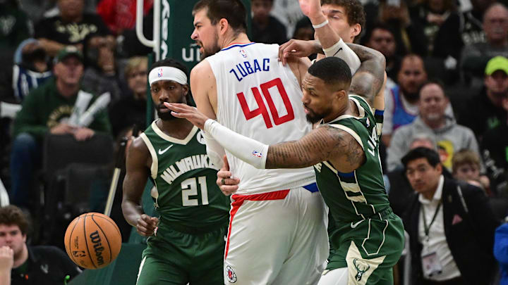 Mar 4, 2024; Milwaukee, Wisconsin, USA; Milwaukee Bucks guard Patrick Beverley (21) and guard Damian Lillard (0) put pressure on Los Angeles Clippers center Ivica Zubac (40) in the third quarter at Fiserv Forum. Mandatory Credit: Benny Sieu-Imagn Images Mar 4, 2024; Milwaukee, Wisconsin, USA; Milwaukee Bucks guard Patrick Beverley (21) and guard Damian Lillard (0) put pressure on Los Angeles Clippers center Ivica Zubac (40) in the third quarter at Fiserv Forum. Mandatory Credit: Benny Sieu-Imagn Images