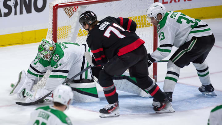 sFeb 22, 2024; Ottawa, Ontario, CAN; Dallas Stars goalie Scott Wedgewood (41) makes a save in front of Ottawa Senators center Ridly Greig (71) in the third period at the Canadian Tire Centre. Mandatory Credit: Marc DesRosiers-Imagn Images