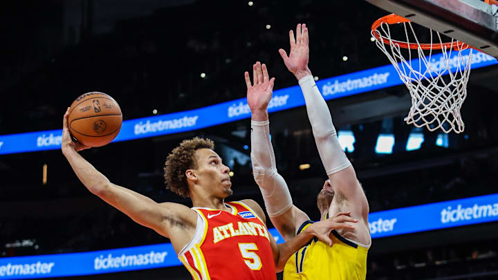 Jan 26, 2026; Atlanta, Georgia, USA; Atlanta Hawks guard Dyson Daniels (5) dunks the ball against Indiana Pacers center Micah Potter (11) during the first quarter at State Farm Arena. Mandatory Credit: Jordan Godfree-Imagn Images