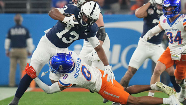 Penn State running back Kaytron Allen is tackled by Boise State safety Ty Benefield.