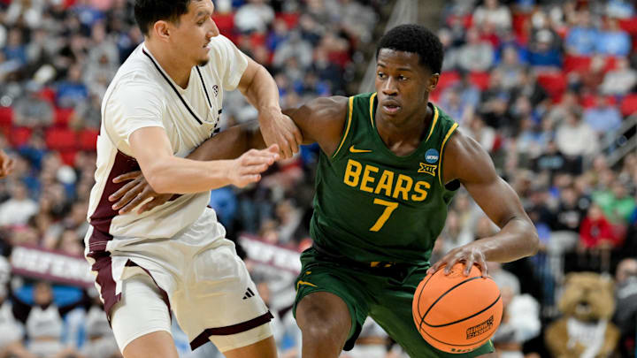 Mar 21, 2025; Raleigh, NC, USA; Mississippi State Bulldogs forward RJ Melendez (22) defends against Baylor Bears guard VJ Edgecombe (7) during the second half in the first round of the NCAA Tournament at Lenovo Center. Mandatory Credit: Zachary Taft-Imagn Images