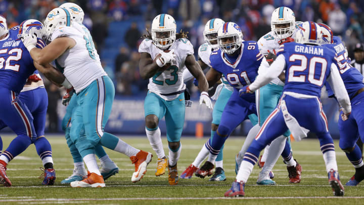 Miami Dolphins running back Jay Ajayi (23) runs the ball in overtime against the Buffalo Bills during their 34-31 victory at New Era Field in December 2016. Miami Dolphins running back Jay Ajayi (23) runs the ball in overtime against the Buffalo Bills during their 34-31 victory at New Era Field in December 2016.
