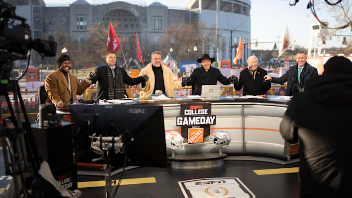 ESPN cast, from left, Desmond Howard, Rece Davis, Pat McAfee, Nick Saban, Lee Corso and Kirk Herbstreit sit on the set of College GameDay prior to the College Football Playoff first round game between the Ohio State Buckeyes and Tennessee Volunteers in Columbus on Dec. 21, 2024.