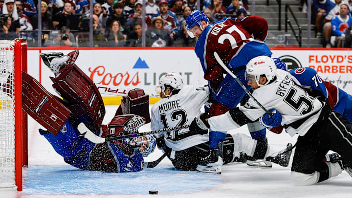 Apr 21, 2026; Denver, Colorado, USA; Colorado Avalanche goaltender Scott Wedgewood (41) watches as Los Angeles Kings right wing Quinton Byfield (55) is unable to control the puck under pressure from defenseman Sam Malinski (70) as left wing Trevor Moore (12) and defenseman Brett Kulak (27) defend in the third period in game two of the first round of the 2026 Stanley Cup Playoffs at Ball Arena. Mandatory Credit: Isaiah J. Downing-Imagn Images