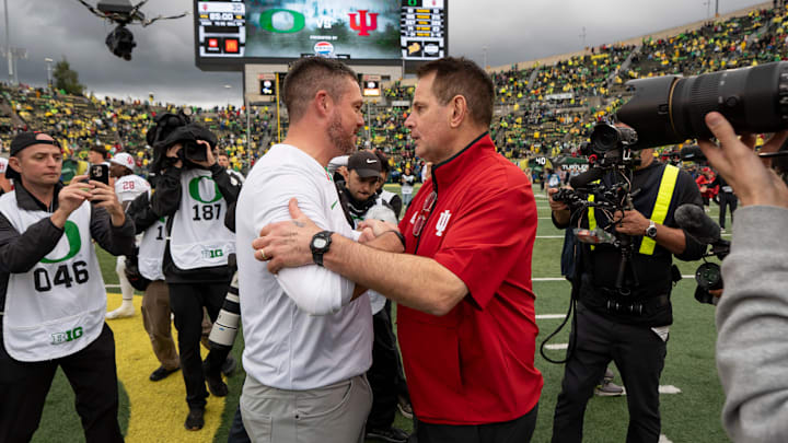Oregon head coach Dan Lanning, left, shakes hands with Indiana head coach Curt Cignetti as the Oregon Ducks host the Indiana Hoosiers Oct. 11, 2025, at Autzen Stadium in Eugene, Oregon.
