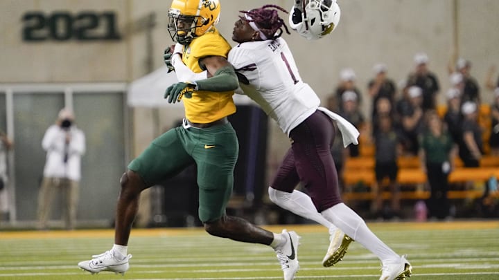 Sep 2, 2023; Waco, Texas, USA; Baylor Bears wide receiver Hal Presley (16) is tackled by Texas State Bobcats cornerback Joshua Eaton (1) after a reception during the second half at McLane Stadium. Mandatory Credit: Raymond Carlin III-Imagn Images