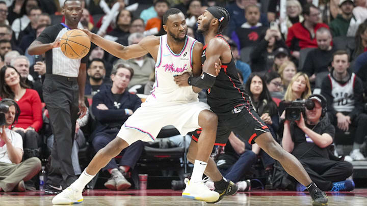 Feb 21, 2025; Toronto, Ontario, CAN; Miami Heat forward Andrew Wiggins (22) dribbles the ball against Toronto Raptors guard Immanuel Quickley (5) at Scotiabank Arena. Mandatory Credit: Kevin Sousa-Imagn Images