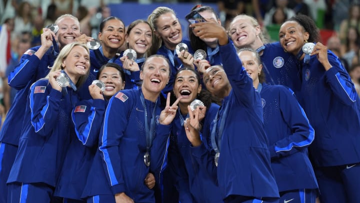 United States volleyball players celebrate with their silver medals United States volleyball players celebrate with their silver medals