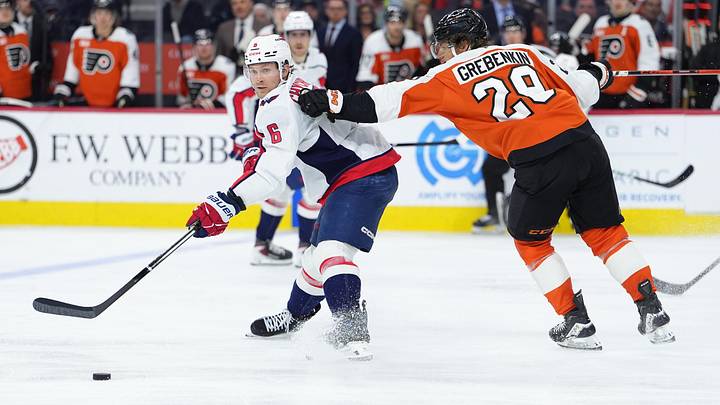 Mar 11, 2026; Philadelphia, Pennsylvania, USA; Washington Capitals defenseman Jakob Chychrun (6) passes the puck against Philadelphia Flyers right wing Nikita Grebenkin (29) in the third period at Xfinity Mobile Arena. Mandatory Credit: Kyle Ross-Imagn Images