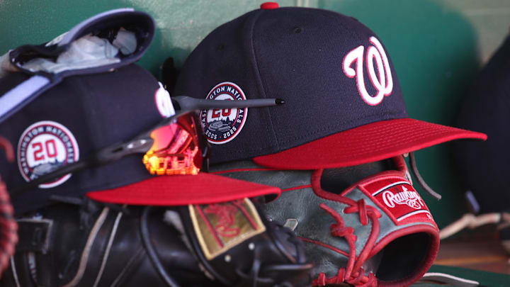 Apr 17, 2025; Pittsburgh, Pennsylvania, USA; Washington Nationals hats and gloves in the dugout against the Pittsburgh Pirates during the sixth inning at PNC Park.
