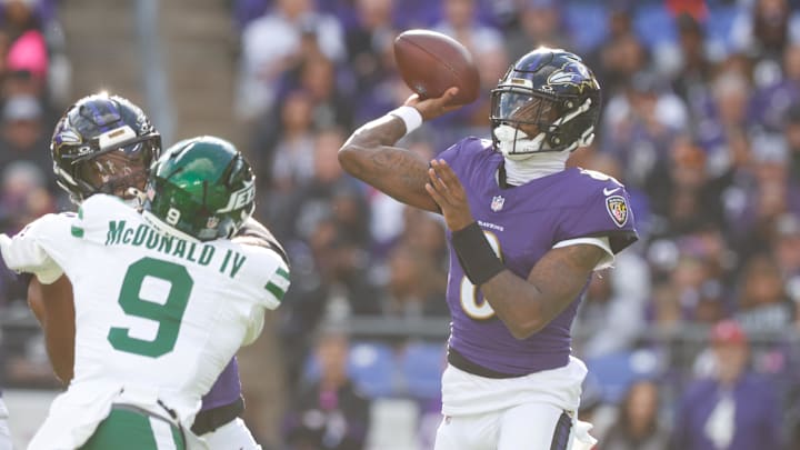 Nov 23, 2025; Baltimore, Maryland, USA; Baltimore Ravens quarterback Lamar Jackson (8) throws a pass during the second quarter against the New York Jets at M&T Bank Stadium. Mandatory Credit: Peter Casey-Imagn Images