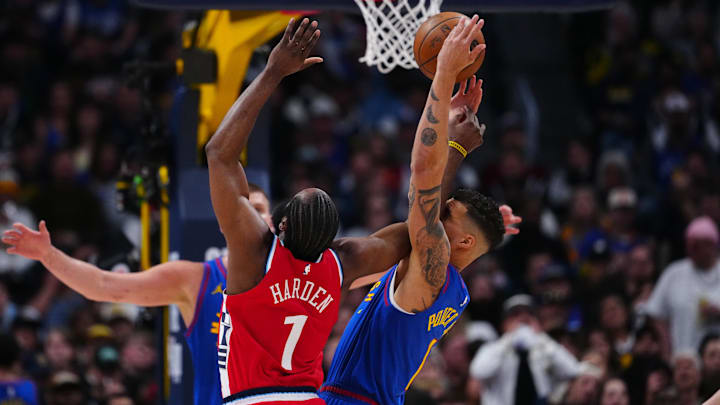 Apr 19, 2025; Denver, Colorado, USA; LA Clippers guard James Harden (1) and Denver Nuggets forward Michael Porter Jr. (1) reach for the ball in the second half at Ball Arena. Mandatory Credit: Ron Chenoy-Imagn Images