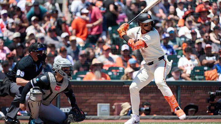 May 24, 2026; San Francisco, California, USA; San Francisco Giants outfielder Victor Bericoto (78) bats near Chicago White Sox catcher Edgar Quero (26) and home plate umpire Chris Guccione (68) during the first inning at Oracle Park. Mandatory Credit: Robert Edwards-Imagn Images