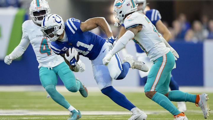 Oct 20, 2024; Indianapolis, Indiana, USA; Indianapolis Colts wide receiver Michael Pittman Jr. (11) rushes after making a catch during a game against the Miami Dolphins at Lucas Oil Stadium. Mandatory Credit: Grace Hollars/IndyStar USA TODAY Network via Imagn Images