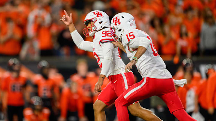 Houston Cougars place kicker Ethan Sanchez (92) celebrates his winning field goal kick in overtime with quarterback Jake Sock (15) against the Oregon State Beavers at Reser Stadium. Houston Cougars place kicker Ethan Sanchez (92) celebrates his winning field goal kick in overtime with quarterback Jake Sock (15) against the Oregon State Beavers at Reser Stadium.