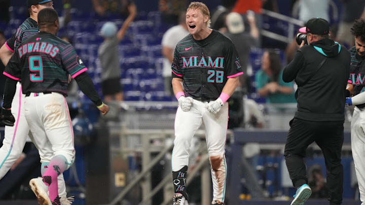 May 3, 2025; Miami, Florida, USA;  Miami Marlins right fielder Kyle Stowers (28) celebrates his walk-off grand slam against the Oakland Athletics in the ninth inning at loanDepot Park. Mandatory Credit: Jim Rassol-Imagn Images