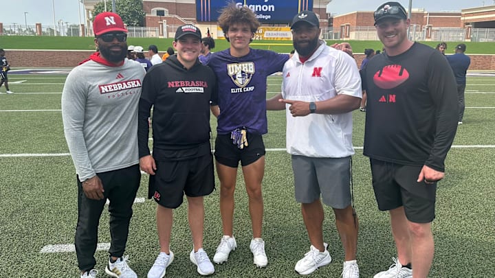 2027 wide receiver Jordan Frohock (center) with several Husker coaches after receiving his scholarship offer in 2024.