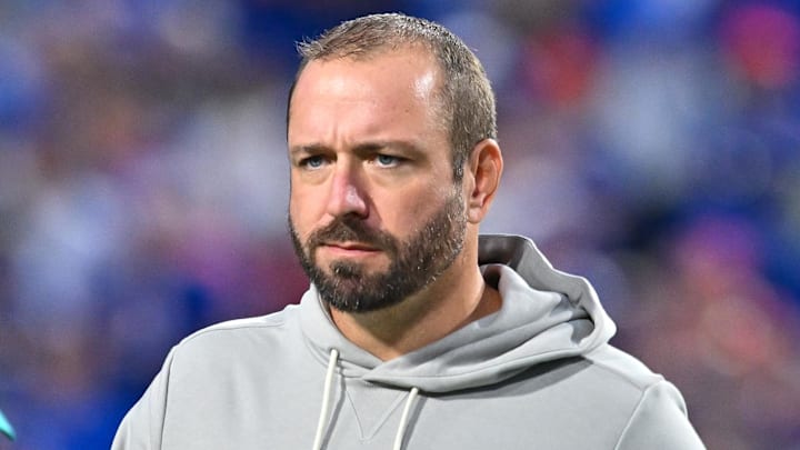 Miami Dolphins offensive coordinator Frank Smith on the field before a game against the Buffalo Bills at Highmark Stadium. Miami Dolphins offensive coordinator Frank Smith on the field before a game against the Buffalo Bills at Highmark Stadium.