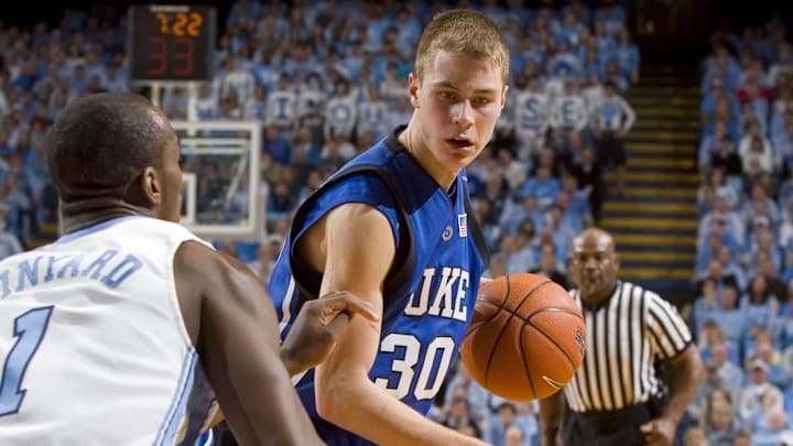 Mar. 4, 2007, Chapel Hill, NC, USA; Duke Blue Devils (30) Jon Scheyer drives as North Carolina Tar Heels (1) Marcus Ginyard defends in the Tar Heels' 86-72 victory against the Blue Devils.