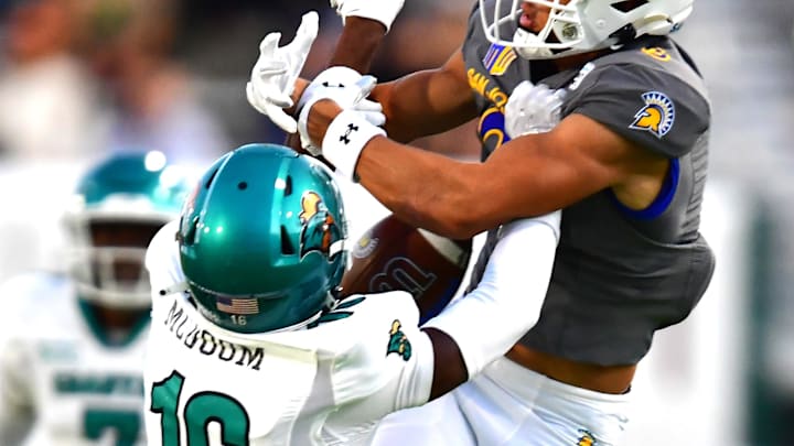 Dec 23, 2023; Honolulu, HI, USA; San Jose State Spartans wide receiver Nick Nash (3) and Coastal Carolina Chanticleers cornerback Matthew McDoom (16) fight for a pass during the third quarter of the Easypost Hawaii Bowl at Clarence T.C. Ching Athletics Complex. Mandatory Credit: Steven Erler-Imagn Images