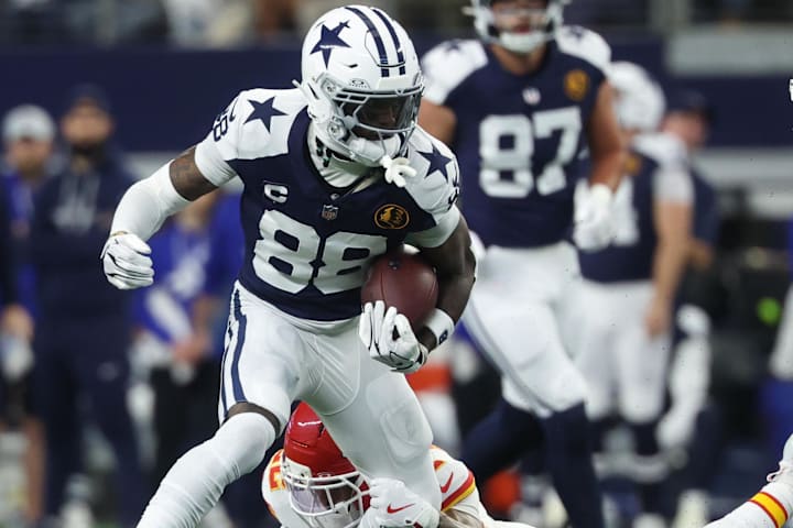 Dallas Cowboys wide receiver CeeDee Lamb carries the ball against Kansas City Chiefs cornerback Trent McDuffie.