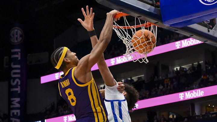 Mar 11, 2026; Nashville, TN, USA;  Louisiana State Tigers forward Pablo Tamba (8) dunks over Kentucky Wildcats center Malachi Moreno (24) during the second half at Bridgestone Arena. Mandatory Credit: Steve Roberts-Imagn Images
