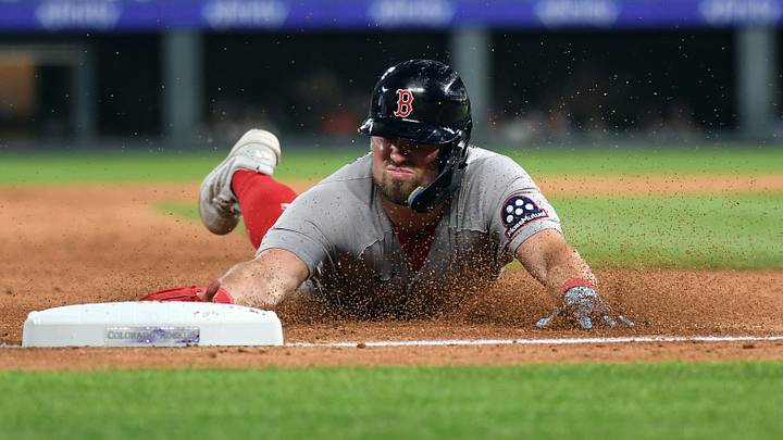 Jun 22, 2026; Denver, Colorado, USA; Boston Red Sox infielder Caleb Durbin (5) slides safely into third base in the ninth inning against the Colorado Rockies at Coors Field. Mandatory Credit: Christopher Hanewinckel-Imagn Images